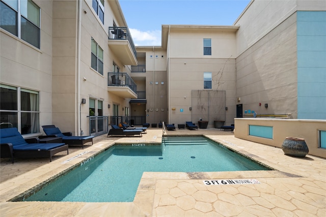 view of pool featuring a patio area