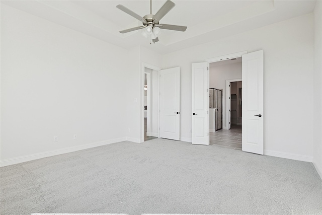 unfurnished bedroom with carpet flooring, ceiling fan, and baseboards