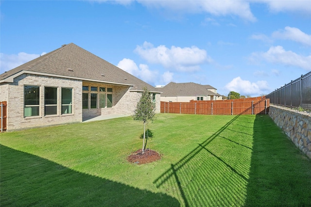 view of yard with a fenced backyard