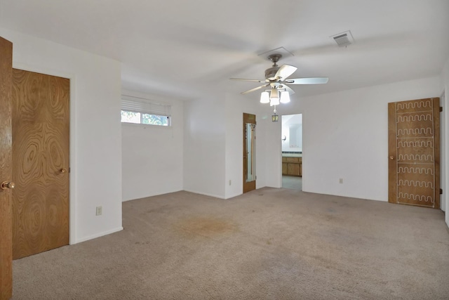 empty room with ceiling fan and light colored carpet