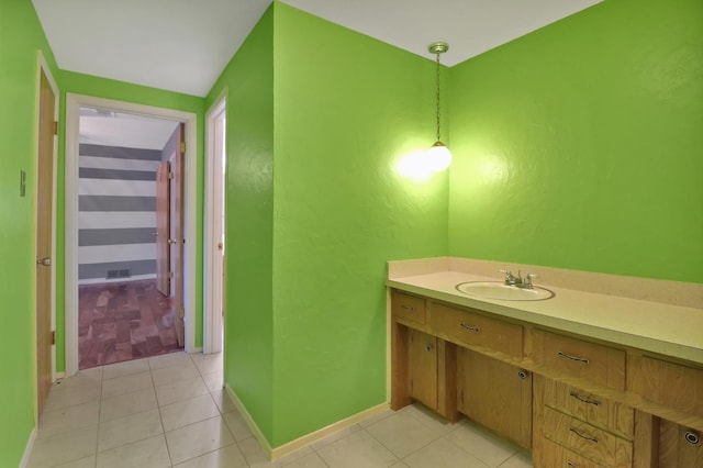 bathroom with tile patterned flooring and vanity