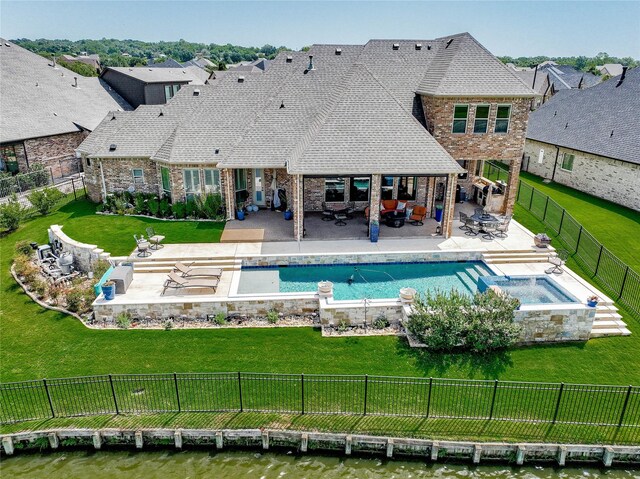 view of swimming pool with a patio and a lawn