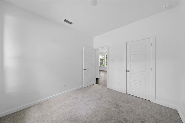 unfurnished bedroom with light carpet