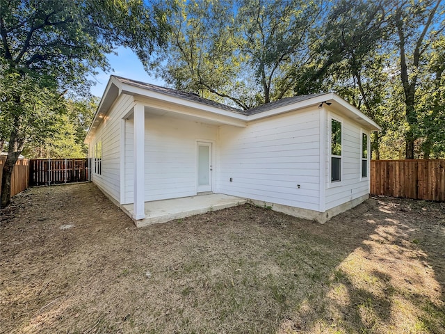 back of house with a patio area