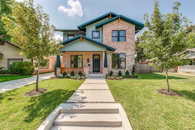 craftsman-style home featuring a front lawn