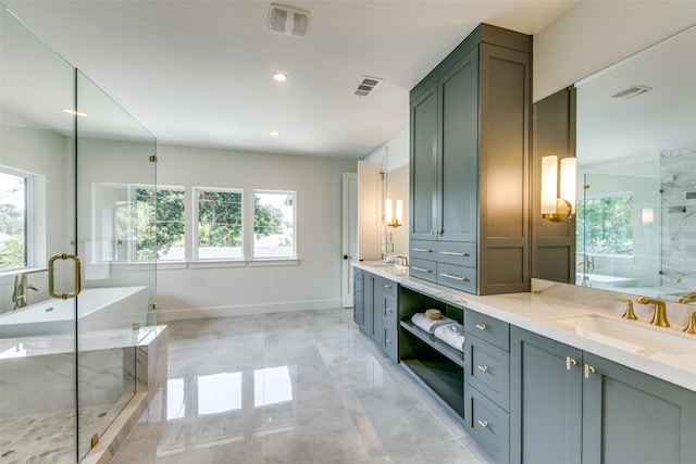 bathroom featuring tile patterned flooring, separate shower and tub, and vanity