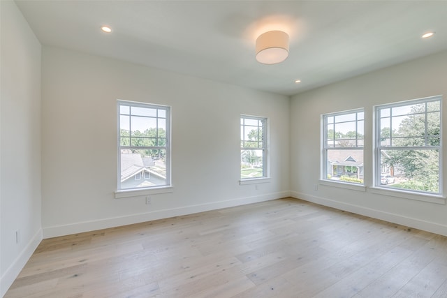 spare room with light wood-type flooring