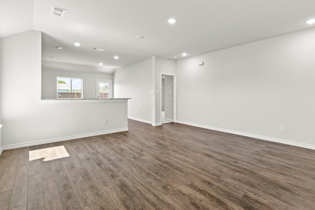 unfurnished living room featuring dark hardwood / wood-style floors