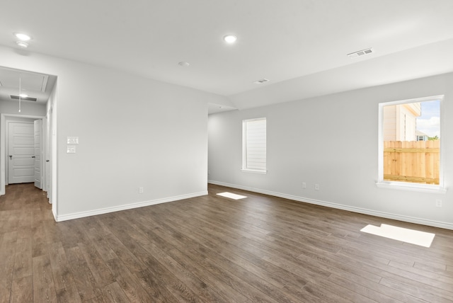 empty room featuring dark wood-type flooring