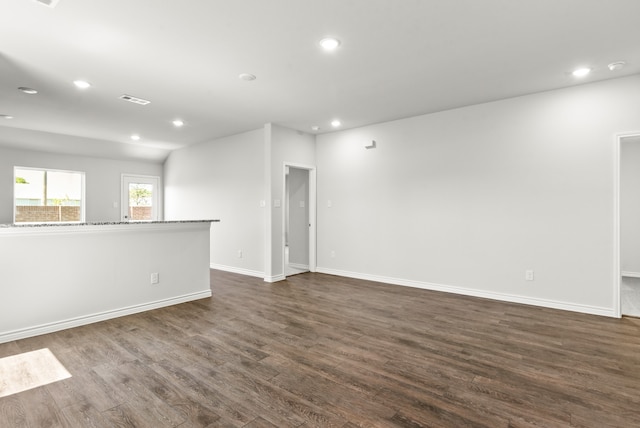 unfurnished living room with dark hardwood / wood-style floors