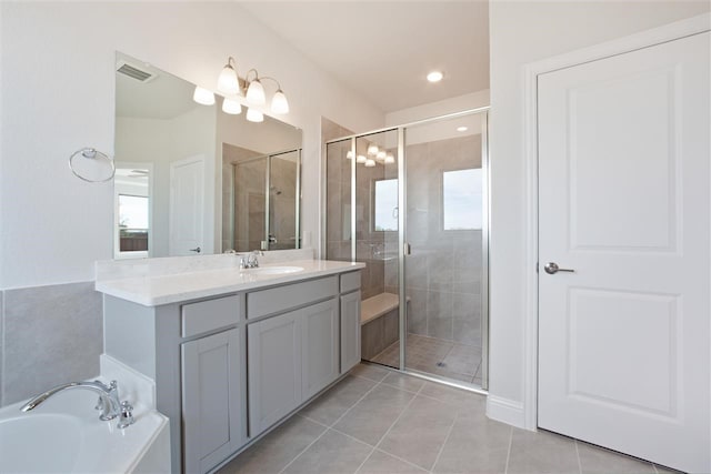 bathroom with vanity, tile patterned floors, and separate shower and tub