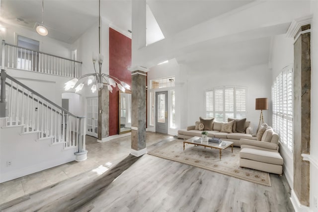 living room with hardwood / wood-style floors and a high ceiling