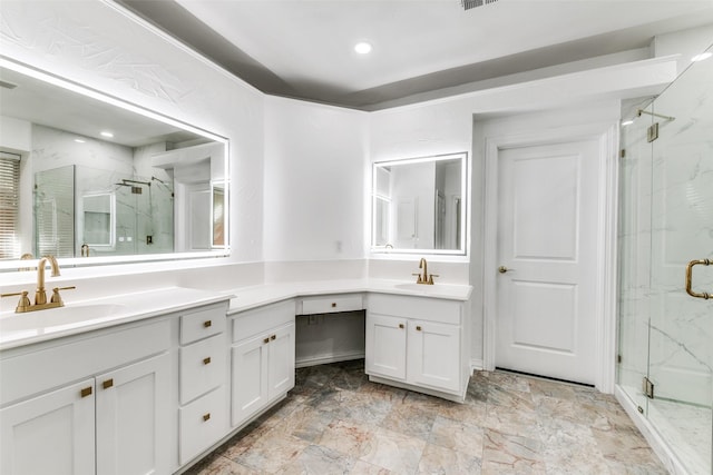 bathroom featuring vanity and a shower with door