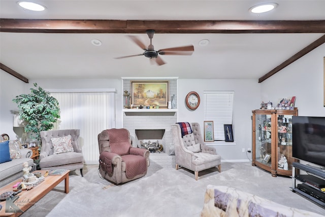 living room featuring carpet, beam ceiling, and ceiling fan