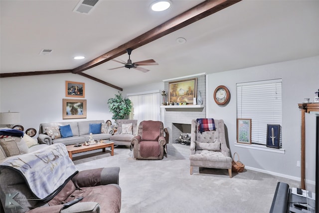 carpeted living room with a fireplace, vaulted ceiling with beams, and ceiling fan