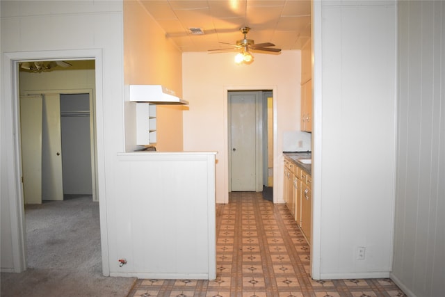 kitchen with light tile patterned floors and ceiling fan