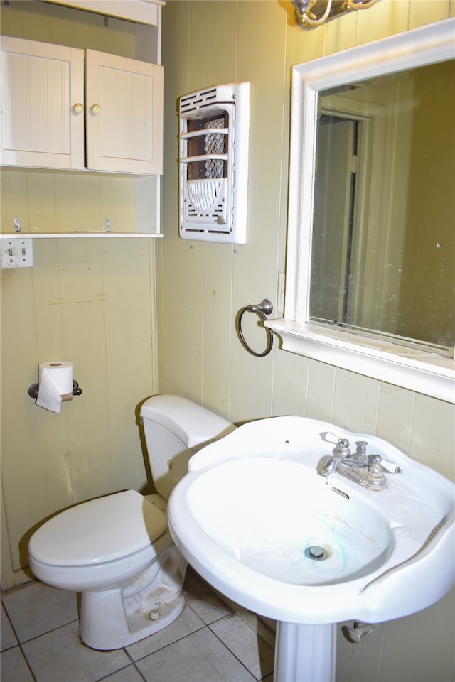 bathroom featuring toilet and tile patterned floors