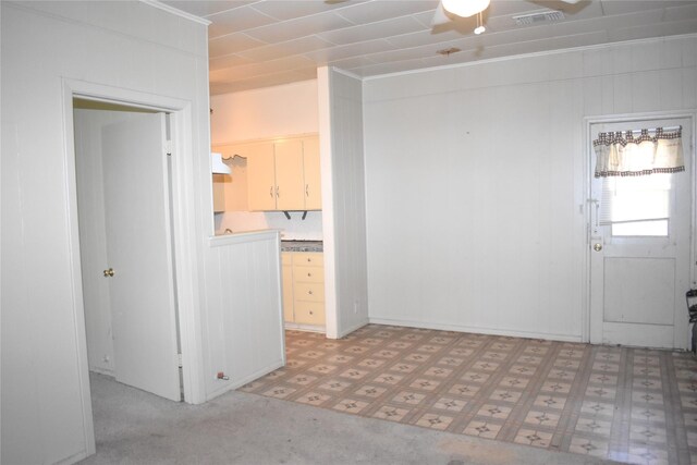 unfurnished living room with tile patterned floors and ceiling fan