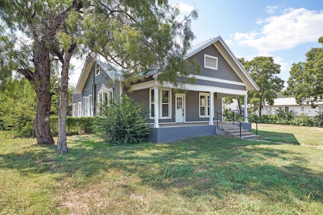 view of front of house featuring a front yard and a porch