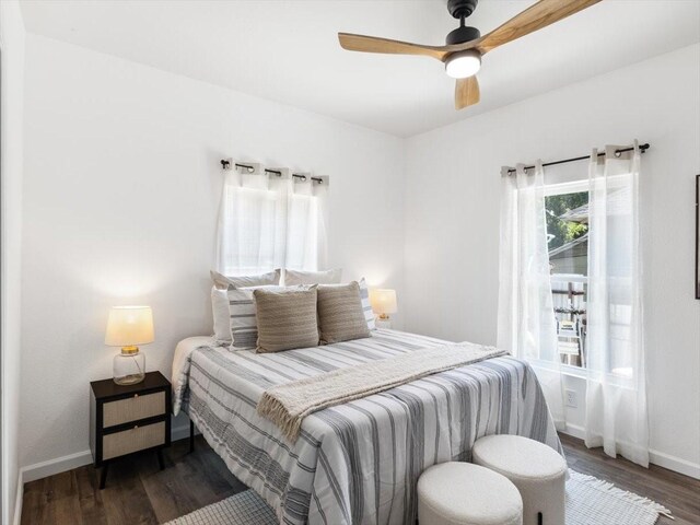 bedroom featuring dark hardwood / wood-style floors and ceiling fan