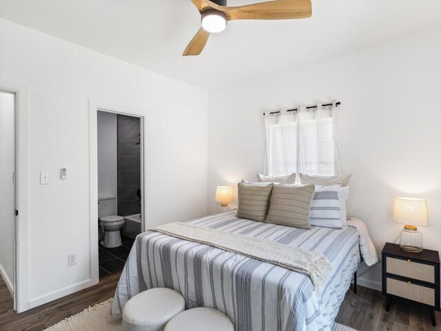 bedroom featuring connected bathroom, ceiling fan, and dark wood-type flooring