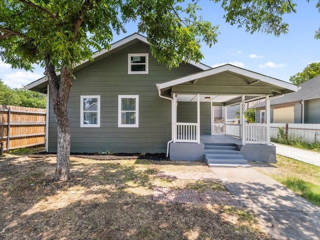 back of property featuring a porch