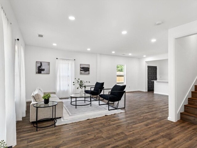 living room with dark wood-type flooring