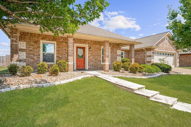 single story home featuring a garage and a front lawn