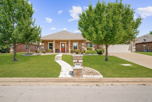 view of front facade with a garage and a front lawn