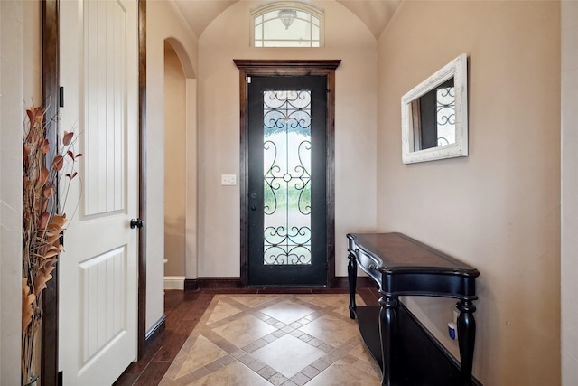 foyer entrance with vaulted ceiling