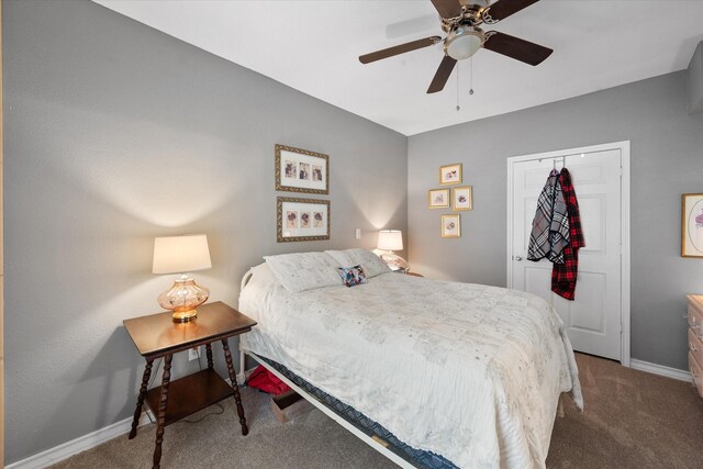 bedroom featuring a closet, ceiling fan, and carpet floors