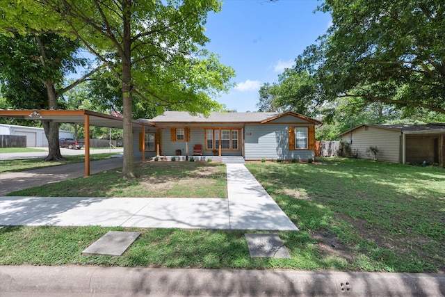 ranch-style house with a front yard and a carport