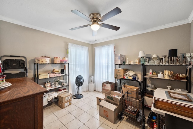 tiled office space featuring ceiling fan and ornamental molding