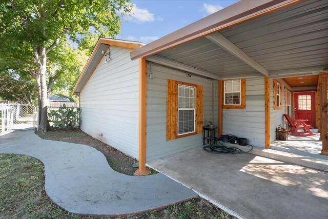 view of property exterior with a patio