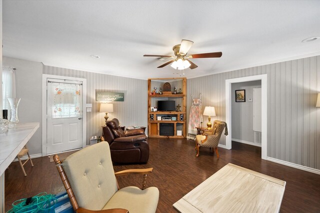 living room featuring ceiling fan and hardwood / wood-style flooring