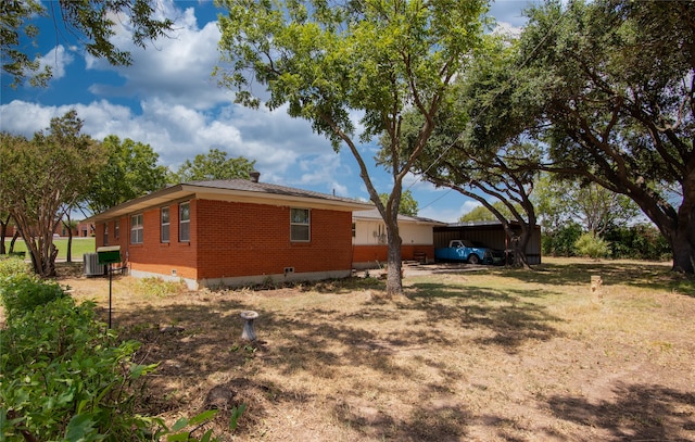 view of home's exterior with central AC unit