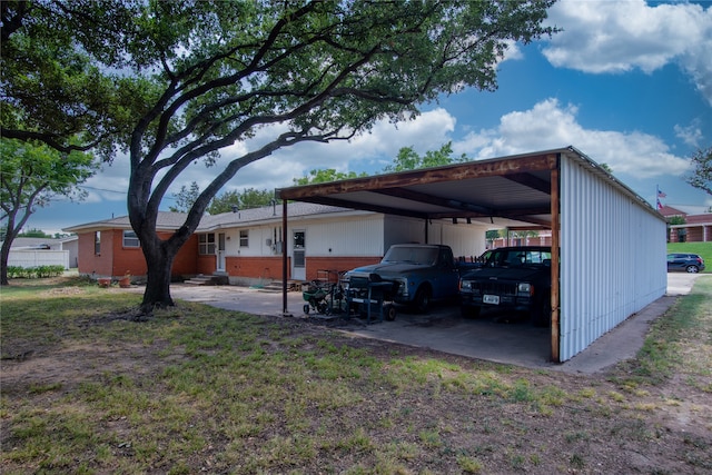 exterior space with a carport