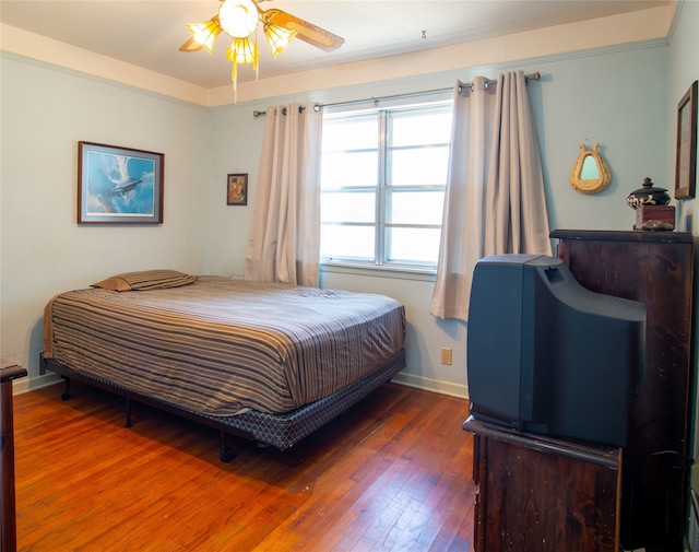 bedroom featuring wood-type flooring and ceiling fan