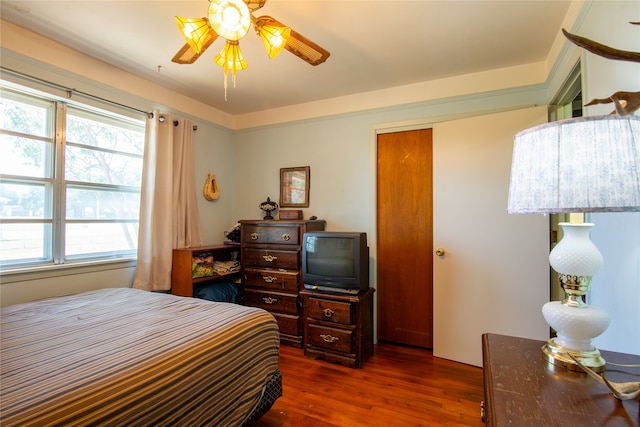 bedroom featuring dark hardwood / wood-style floors and ceiling fan