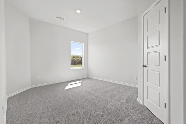 spare room featuring carpet flooring