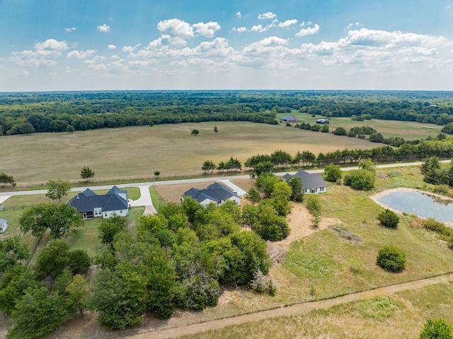 birds eye view of property with a water view and a rural view