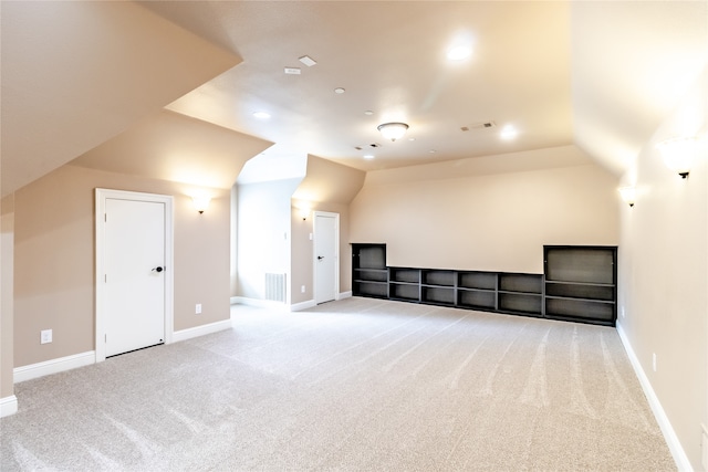 bonus room with vaulted ceiling, carpet, visible vents, and baseboards