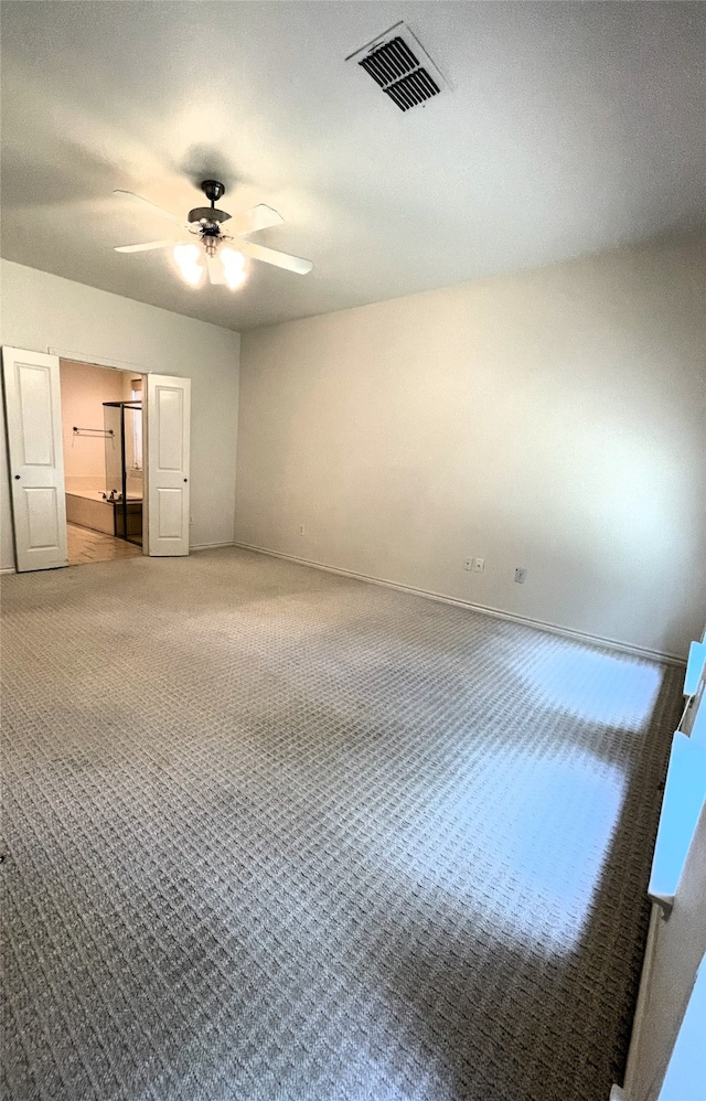 unfurnished bedroom featuring ceiling fan and carpet floors