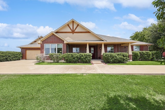 view of front of property with a garage and a front yard