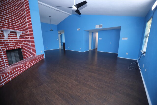 unfurnished living room featuring a brick fireplace, hardwood / wood-style floors, high vaulted ceiling, and ceiling fan