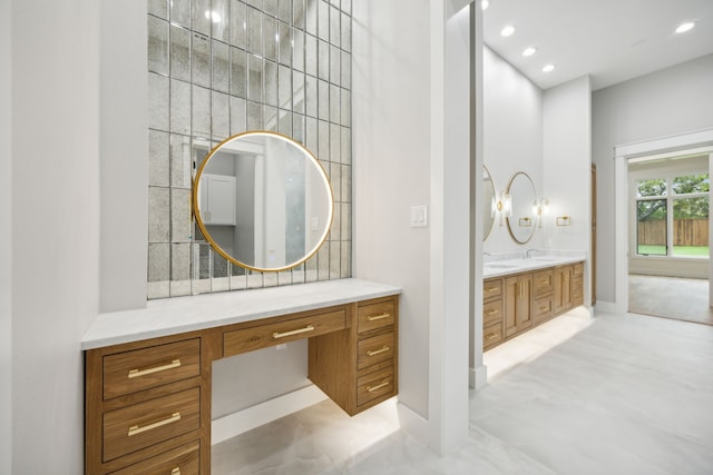 bathroom with vanity and concrete floors