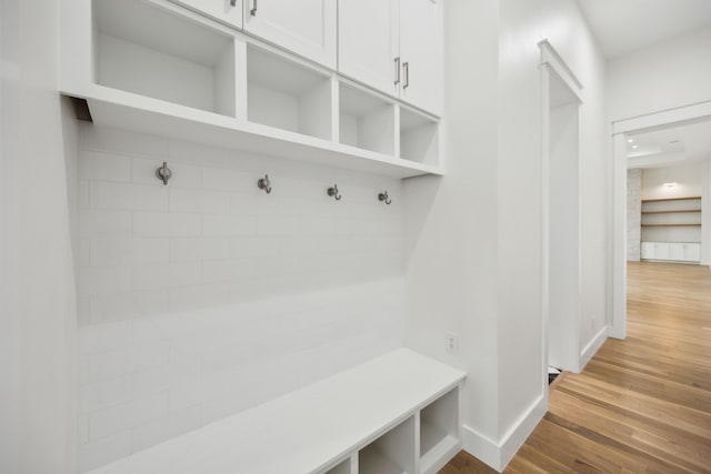 mudroom with light hardwood / wood-style floors