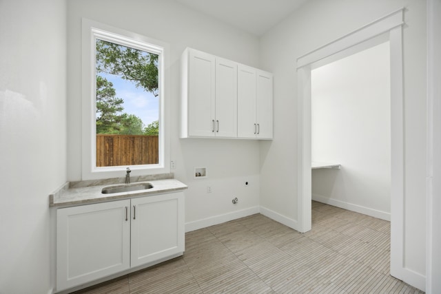 laundry room with cabinets, hookup for an electric dryer, sink, and hookup for a washing machine