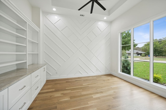 interior space featuring light wood-type flooring and ceiling fan