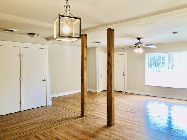 interior space with ceiling fan and light hardwood / wood-style flooring